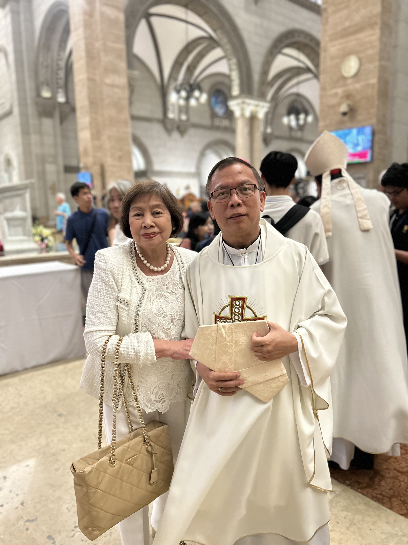 Dra. Luzviminda S. Jose with Bishop Herman Absede following the Mass, in a warm moment of fellowship and shared faith.