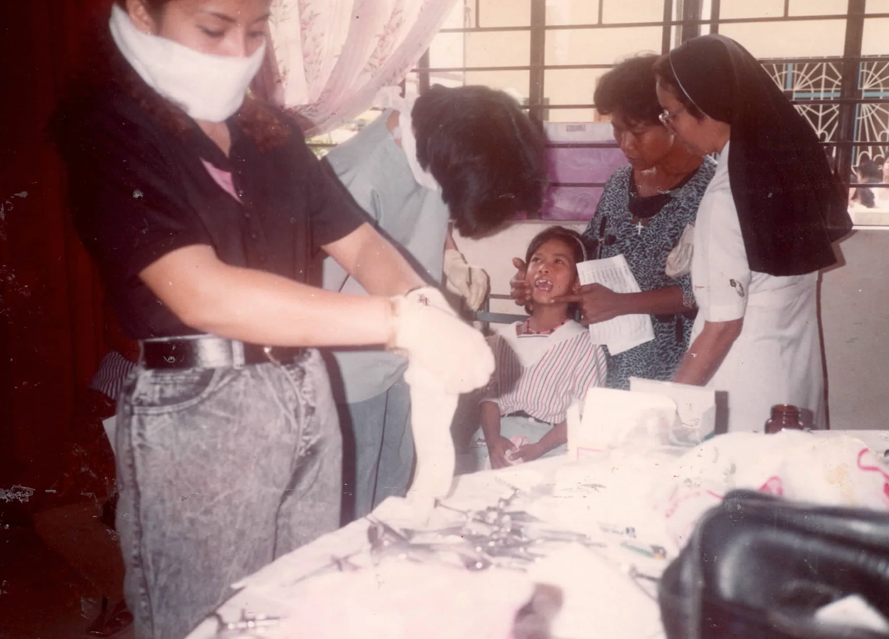 Dental procedure during a Sacred Heart medical mission